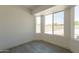 Bright bedroom filled with natural light from large windows and views to the backyard at 6944 E Gary Cir, Mesa, AZ 85207