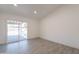 Bright bedroom features tile floors, recessed lighting, and sliding glass doors to the backyard patio at 6944 E Gary Cir, Mesa, AZ 85207