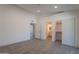 Spacious bedroom with tile floors, closet, bathroom entrance, and multiple lighting fixtures at 6944 E Gary Cir, Mesa, AZ 85207