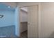 Walk-in closet includes open shelving and wood-look tile floors at 6944 E Gary Cir, Mesa, AZ 85207