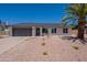 Charming single-story home featuring a two-car garage and desert-style landscaping for easy maintenance at 6944 E Gary Cir, Mesa, AZ 85207