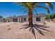 Charming single-story home featuring a two-car garage and desert-style landscaping for easy maintenance at 6944 E Gary Cir, Mesa, AZ 85207