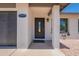 Close up showing the front door and a 2-car garage at 6944 E Gary Cir, Mesa, AZ 85207