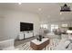 This virtually staged living room includes an open floor plan that leads to the dining area and kitchen at 6944 E Gary Cir, Mesa, AZ 85207