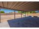 View of the covered patio area with custom pavers, perfect for relaxing outdoors at 6944 E Gary Cir, Mesa, AZ 85207