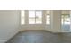Bright, light-filled room with large windows and sliding glass door at 6944 E Gary Cir, Mesa, AZ 85207
