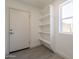 Storage room includes shelving and a bright window at 6944 E Gary Cir, Mesa, AZ 85207