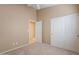 Carpeted bedroom featuring double door closet and ceiling fan at 8158 E Rita Dr, Scottsdale, AZ 85255