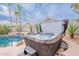 A luxurious hot tub by the pool with palm trees and beautiful landscaping at 8158 E Rita Dr, Scottsdale, AZ 85255