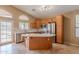 Bright kitchen with kitchen island, stainless steel appliances, tile flooring and plenty of counter space at 8158 E Rita Dr, Scottsdale, AZ 85255
