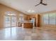 Open kitchen features stainless steel appliances, tile flooring, kitchen island, and plenty of natural light at 8158 E Rita Dr, Scottsdale, AZ 85255