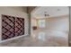 Spacious living room showcases travertine floors, arched entryways, and a built-in wine rack at 8158 E Rita Dr, Scottsdale, AZ 85255