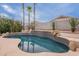 Backyard pool featuring palm trees, surrounding landscape and water feature at 8158 E Rita Dr, Scottsdale, AZ 85255