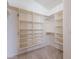 Walk-in closet featuring built-in shelves and plenty of storage space at 8158 E Rita Dr, Scottsdale, AZ 85255