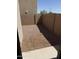 The home has a gravel backyard enclosed by a tall brick wall at 8208 W Albeniz Pl, Phoenix, AZ 85043