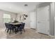 Bright dining room featuring a table with stylish chairs and contemporary decor at 8208 W Albeniz Pl, Phoenix, AZ 85043