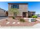 Charming two-story home with a landscaped front yard and neutral-colored exterior at 8208 W Albeniz Pl, Phoenix, AZ 85043