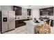 Well-equipped kitchen with a spacious island, stainless steel appliances, and modern decor at 8208 W Albeniz Pl, Phoenix, AZ 85043