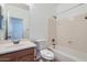 Bathroom with a single sink vanity and a shower-tub combo at 8766 W Hayward Ave, Glendale, AZ 85305