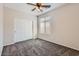 This bedroom has a ceiling fan and a closet with sliding doors at 8766 W Hayward Ave, Glendale, AZ 85305