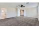 Large main bedroom has neutral walls, a ceiling fan, and an en-suite bathroom at 8766 W Hayward Ave, Glendale, AZ 85305