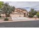 Charming two-story home features a three-car garage, desert landscaping, and a tile roof at 8766 W Hayward Ave, Glendale, AZ 85305