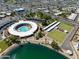 Wonderful aerial view of community clubhouse, pool and recreation area near well kept lawns and tree lined sidewalks at 10137 W Forrester Dr, Sun City, AZ 85351