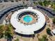 Gorgeous aerial view of the community pool, surrounded by ample parking and lush landscaping for residents to enjoy at 10137 W Forrester Dr, Sun City, AZ 85351