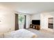 Bright bedroom with a walk-in closet, carpet, and a window at 10137 W Forrester Dr, Sun City, AZ 85351