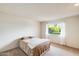 Bright bedroom featuring carpeted floors and a window at 10137 W Forrester Dr, Sun City, AZ 85351