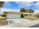 Charming single-story home with a two-car garage and well-maintained front yard at 10137 W Forrester Dr, Sun City, AZ 85351