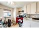 Functional laundry room with washer, dryer, cabinets and natural light at 10137 W Forrester Dr, Sun City, AZ 85351