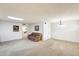 Spacious living room with neutral carpet, ample natural light, and artwork creates a cozy and inviting atmosphere at 10137 W Forrester Dr, Sun City, AZ 85351
