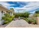 Outdoor patio featuring tiled flooring, lush landscaping, and comfortable seating for relaxation at 10137 W Forrester Dr, Sun City, AZ 85351