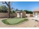 Putting green, storage shed and privacy fence in this well maintained backyard at 10759 N 101St St, Scottsdale, AZ 85260