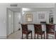 This bar area features a dark countertop and three wooden chairs, perfect for entertaining guests at 10759 N 101St St, Scottsdale, AZ 85260