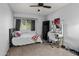 Cozy bedroom with a ceiling fan, desk and storage is perfect for relaxing and easy living at 10759 N 101St St, Scottsdale, AZ 85260