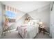 Cute small bedroom with bed and wall decor at 12239 W Caraveo Pl, Peoria, AZ 85383