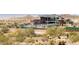 The community pool and clubhouse are set against a backdrop of desert foliage and mountains at 12239 W Caraveo Pl, Peoria, AZ 85383