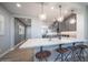 This well-appointed kitchen has an island bar and a stunning view of the adjacent spaces at 12239 W Caraveo Pl, Peoria, AZ 85383