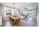 Bright and open living space connecting dining area and living room, perfect for modern living and entertaining at 12239 W Caraveo Pl, Peoria, AZ 85383