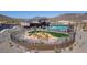 Community playground is next to the clubhouse and features modern play equipment and desert landscaping at 12239 W Caraveo Pl, Peoria, AZ 85383