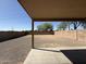 Covered patio with a spacious backyard, great for outdoor living and entertaining at 12547 W Pasadena Ave, Litchfield Park, AZ 85340