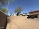 Backyard surrounded by block wall, offering privacy and security for outdoor activities and relaxation at 12547 W Pasadena Ave, Litchfield Park, AZ 85340