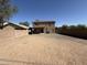 Large backyard space with potential for landscaping and customization, enclosed by a block wall at 12547 W Pasadena Ave, Litchfield Park, AZ 85340