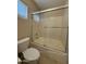 Bathroom features a bathtub with sliding door and shower head at 12547 W Pasadena Ave, Litchfield Park, AZ 85340