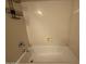 Clean bathtub with shower head, spout, and storage on the wall at 12547 W Pasadena Ave, Litchfield Park, AZ 85340