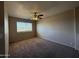 Neutral bedroom featuring a ceiling fan and a window with blinds at 12547 W Pasadena Ave, Litchfield Park, AZ 85340