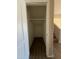 Hall closet with wood floors and a clothing rod at 12547 W Pasadena Ave, Litchfield Park, AZ 85340