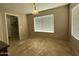 Bright dining room with a large window and tile flooring at 12547 W Pasadena Ave, Litchfield Park, AZ 85340
